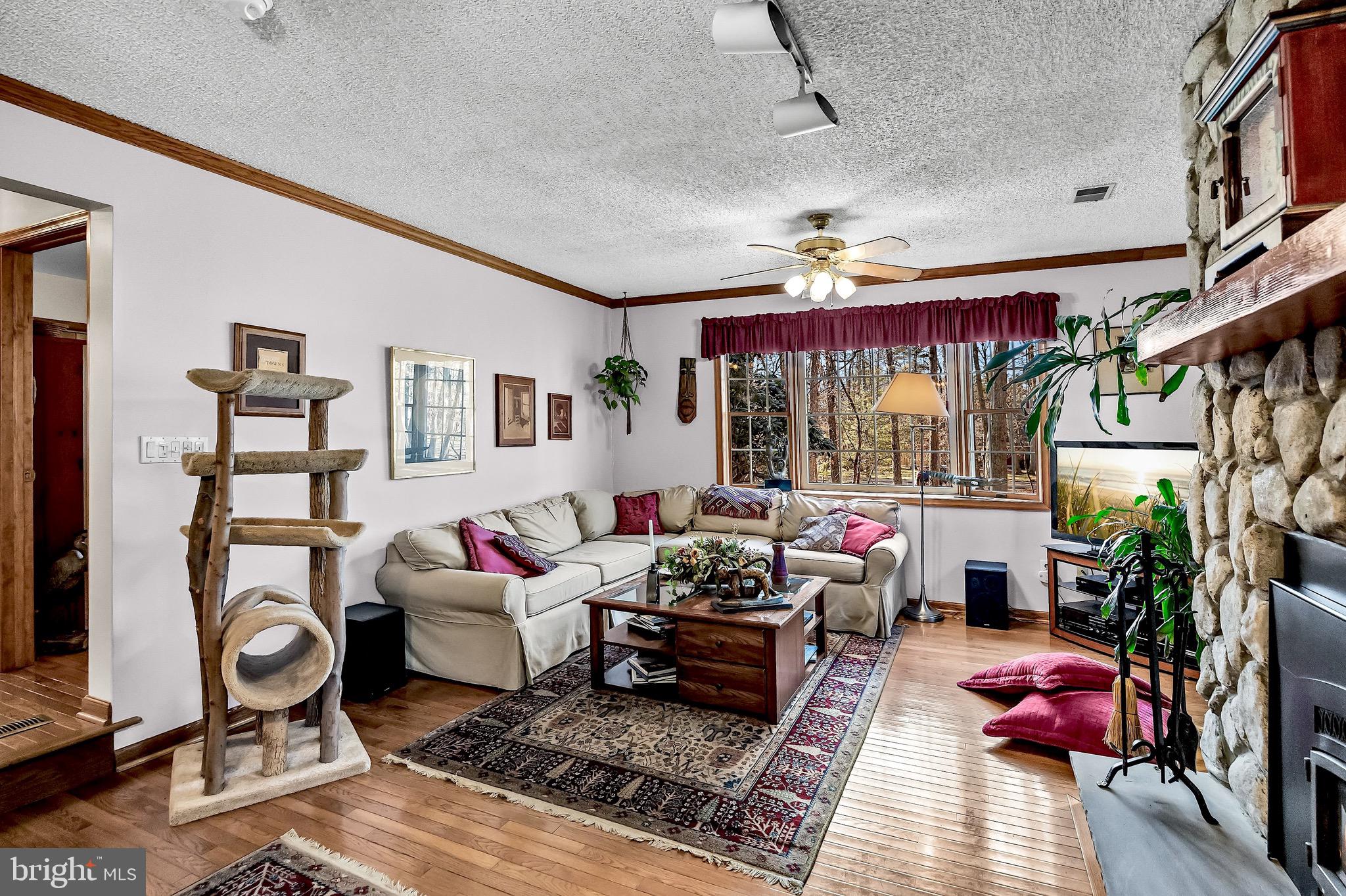 26 Tuckerton Road Shamong, NJ 08088 - Photo 13 of 44 a living room with lots of furniture and a bed