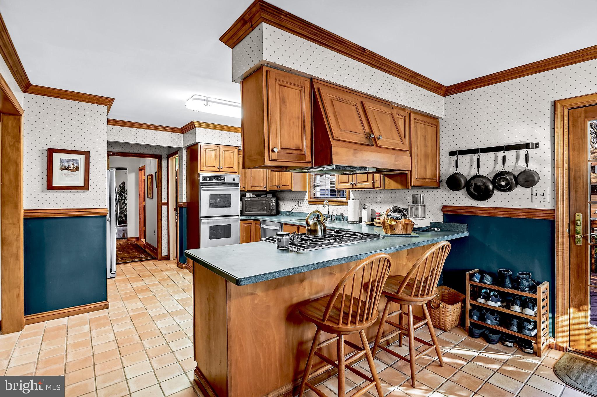 26 Tuckerton Road Shamong, NJ 08088 - Photo 4 of 44 a kitchen with stainless steel appliances granite countertop a stove a sink and a refrigerator