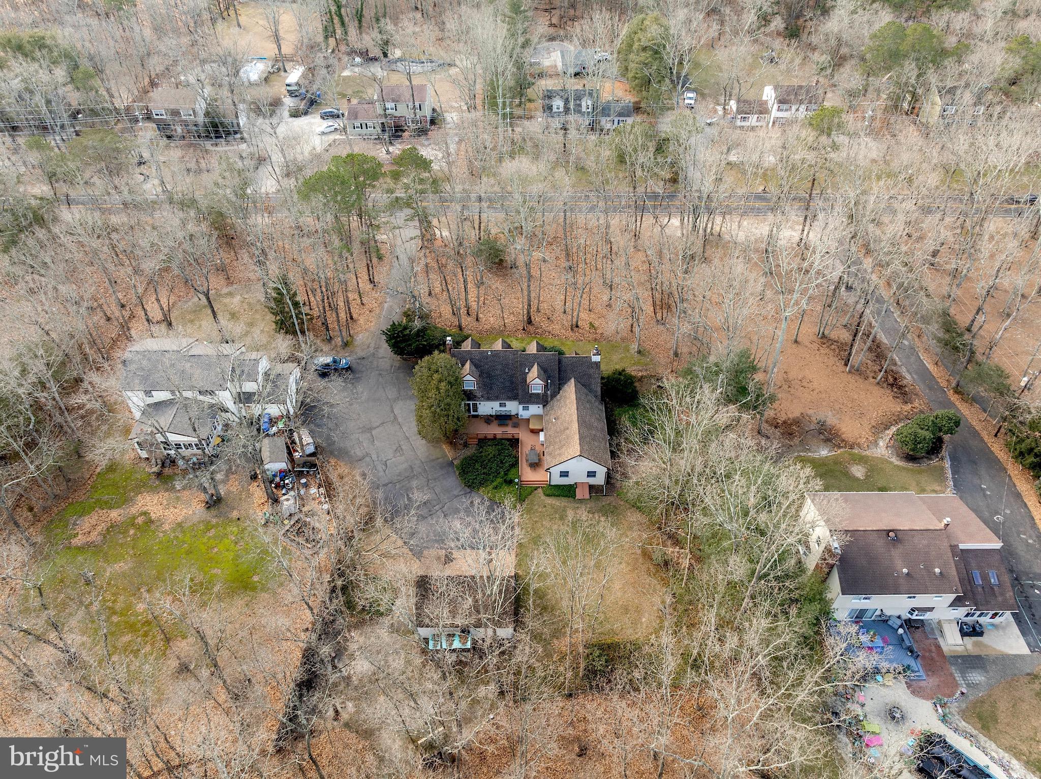26 Tuckerton Road Shamong, NJ 08088 - Photo 41 of 44 a backyard of a house with a yard and outdoor seating