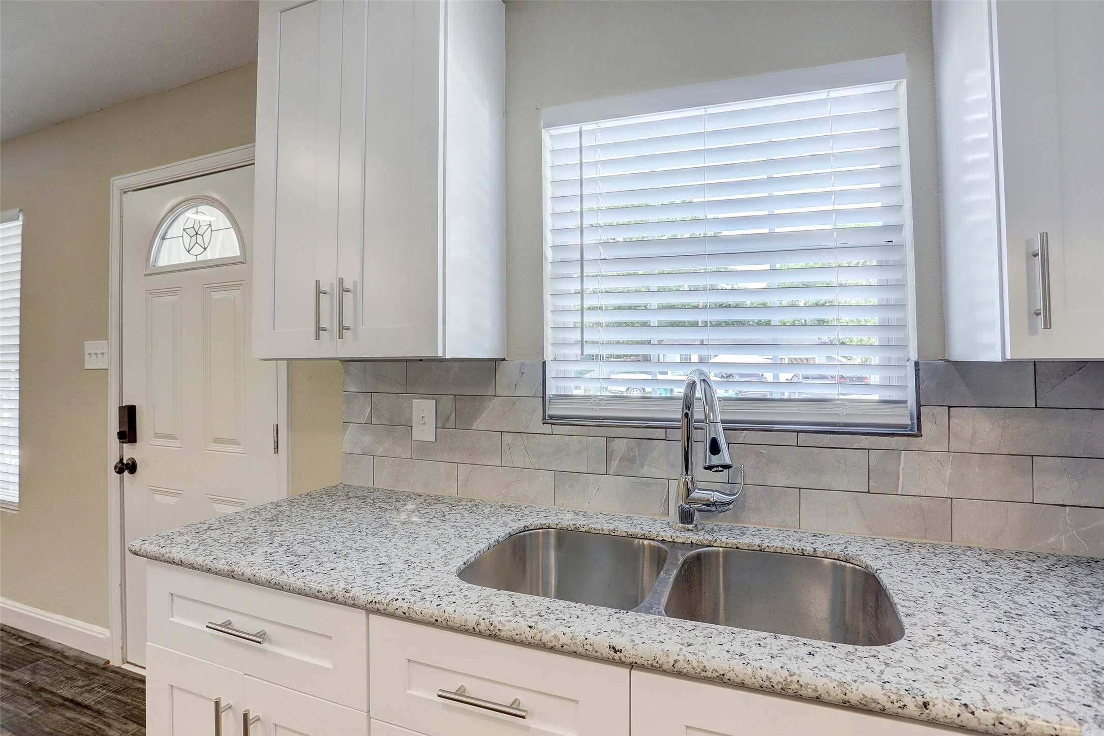 515 Main Street Pasadena, TX 77506 - Photo 4 of 10 a kitchen with granite countertop a sink and cabinets