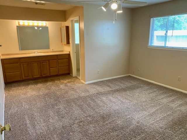 16215 Rill Lane Houston, TX 77062 - Photo 18 of 33 a view of an empty room with window and bathroom