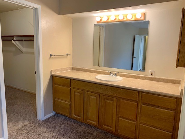 16215 Rill Lane Houston, TX 77062 - Photo 22 of 33 a bathroom with a sink and a mirror