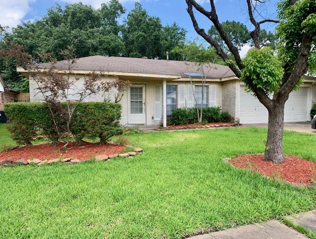 16215 Rill Lane Houston, TX 77062 - Photo 3 of 33 a front view of a house with a yard