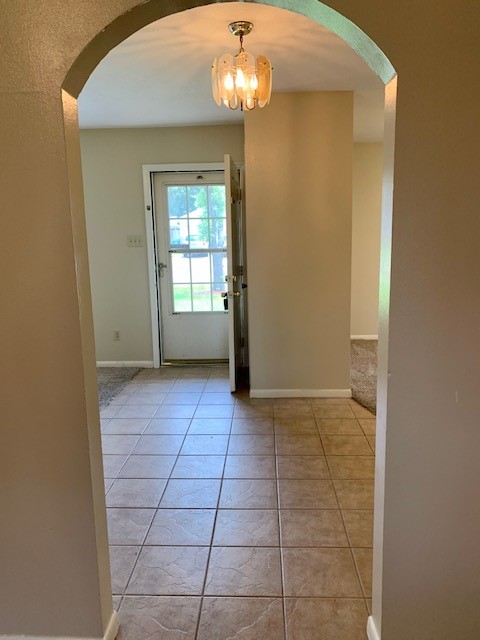 16215 Rill Lane Houston, TX 77062 - Photo 8 of 33 a view of an empty room with window and chandelier