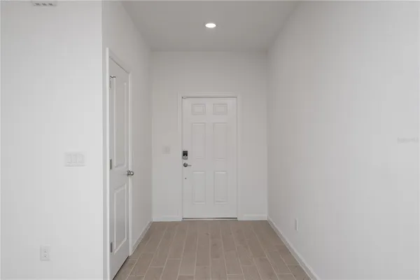 a view of hallway with closet