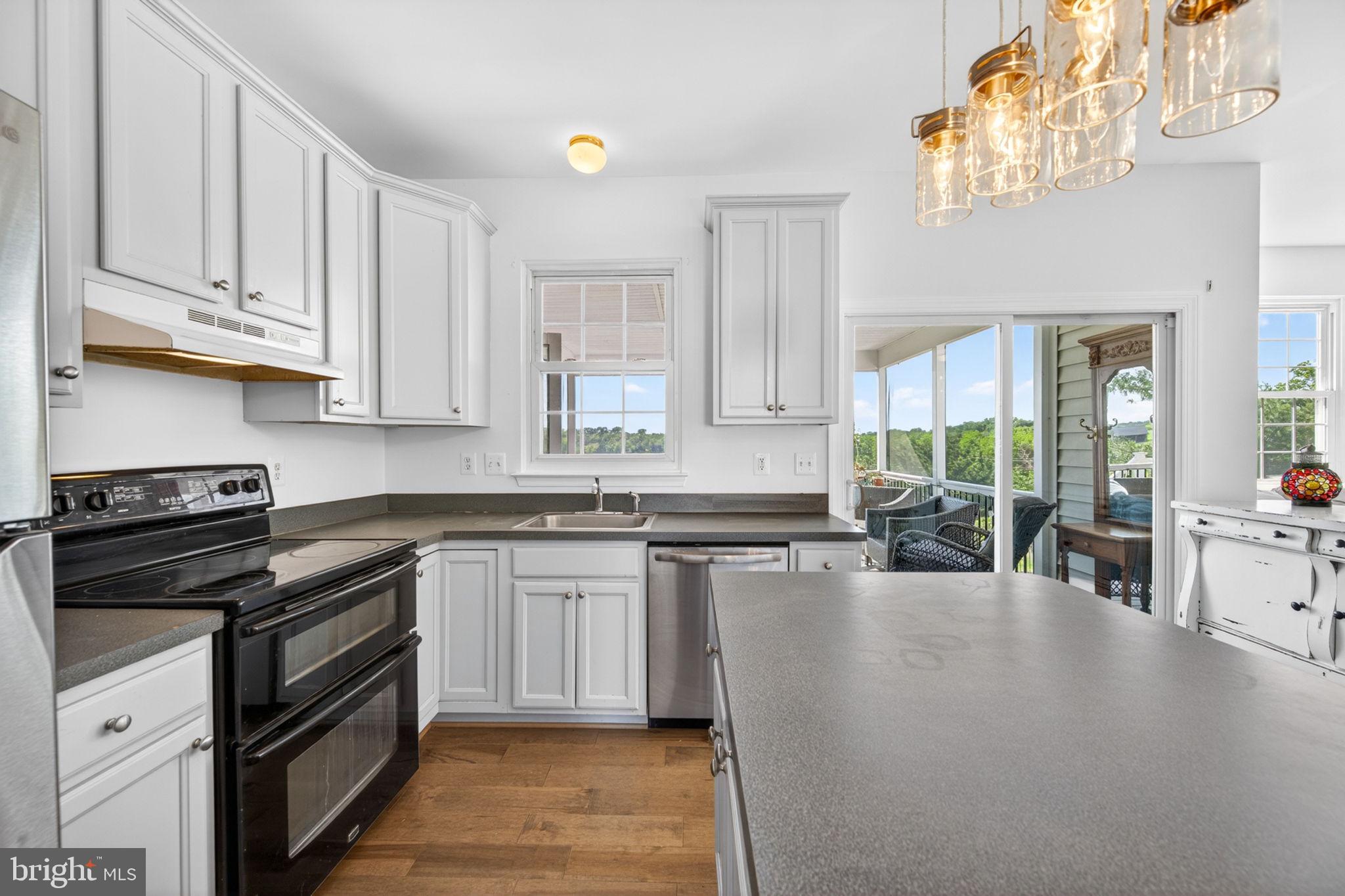 8840 Mapleville Road Mount Airy, MD 21771 - Photo 20 of 106 kitchen with sliding doors to the screened deck