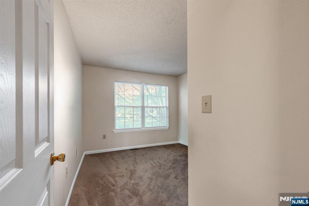 159 Market Street, Unit 1411 Newark, NJ 07102 - Photo 11 of 19 a view of a livingroom with a window