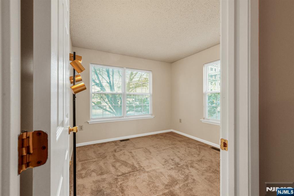 159 Market Street, Unit 1411 Newark, NJ 07102 - Photo 13 of 19 an empty room with windows