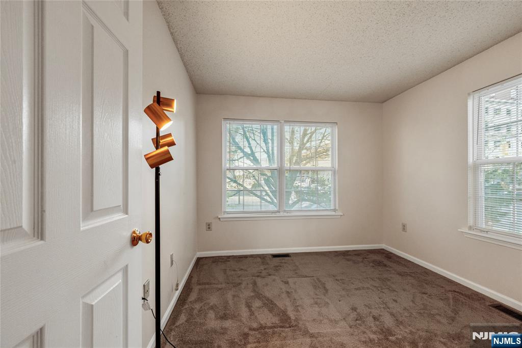 159 Market Street, Unit 1411 Newark, NJ 07102 - Photo 14 of 19 an empty room with windows