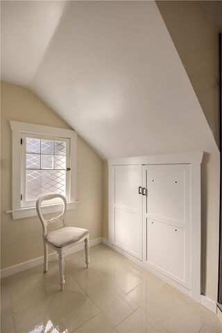 a view of a livingroom with chair and window