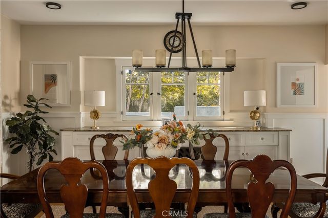 a view of a dining room with furniture and window
