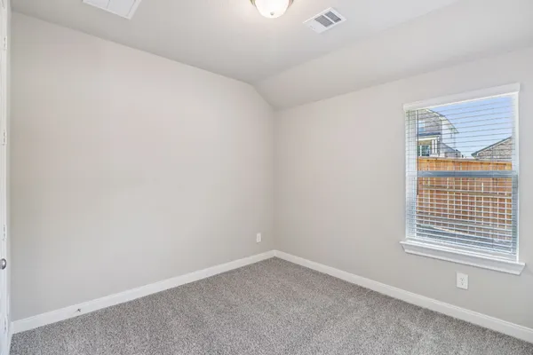 an empty room with closet area