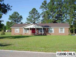 414 South Potter Road Lancaster, SC 29720 - Photo 1 of 8 a front view of a house with a garden