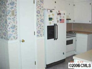 414 South Potter Road Lancaster, SC 29720 - Photo 2 of 8 a kitchen with a refrigerator and a stove