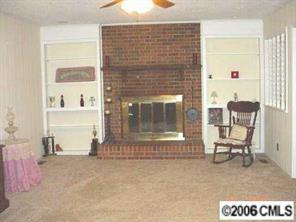 414 South Potter Road Lancaster, SC 29720 - Photo 6 of 8 a living room with furniture and a fireplace