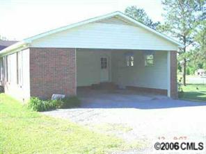 414 South Potter Road Lancaster, SC 29720 - Photo 7 of 8 a front view of a house with a yard