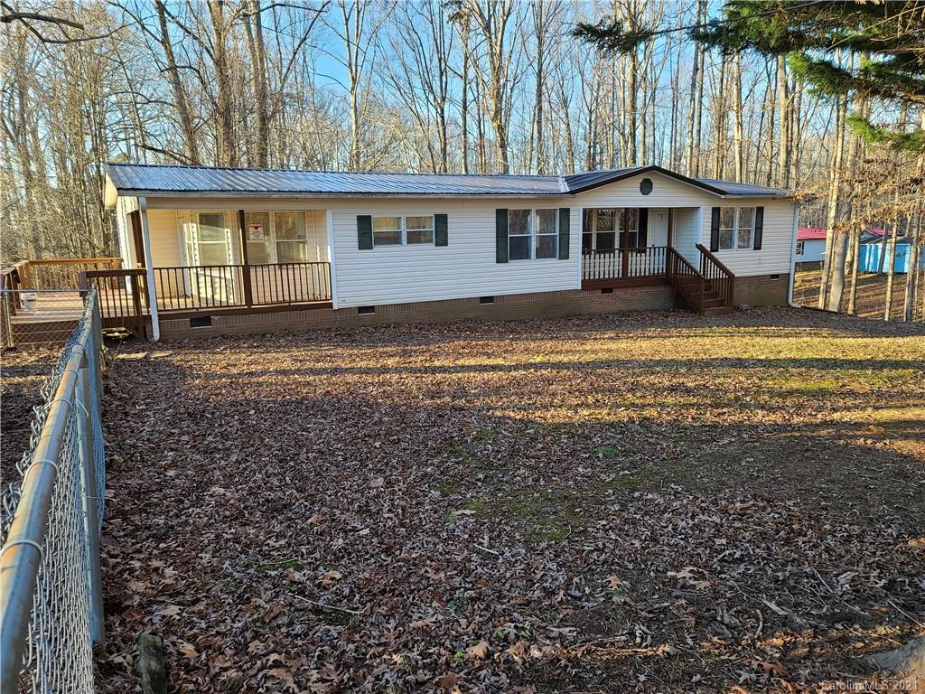 1035 Center Ridge Way Road King, NC 27021 - Photo 3 of 17 a view of a house with a yard and sitting area