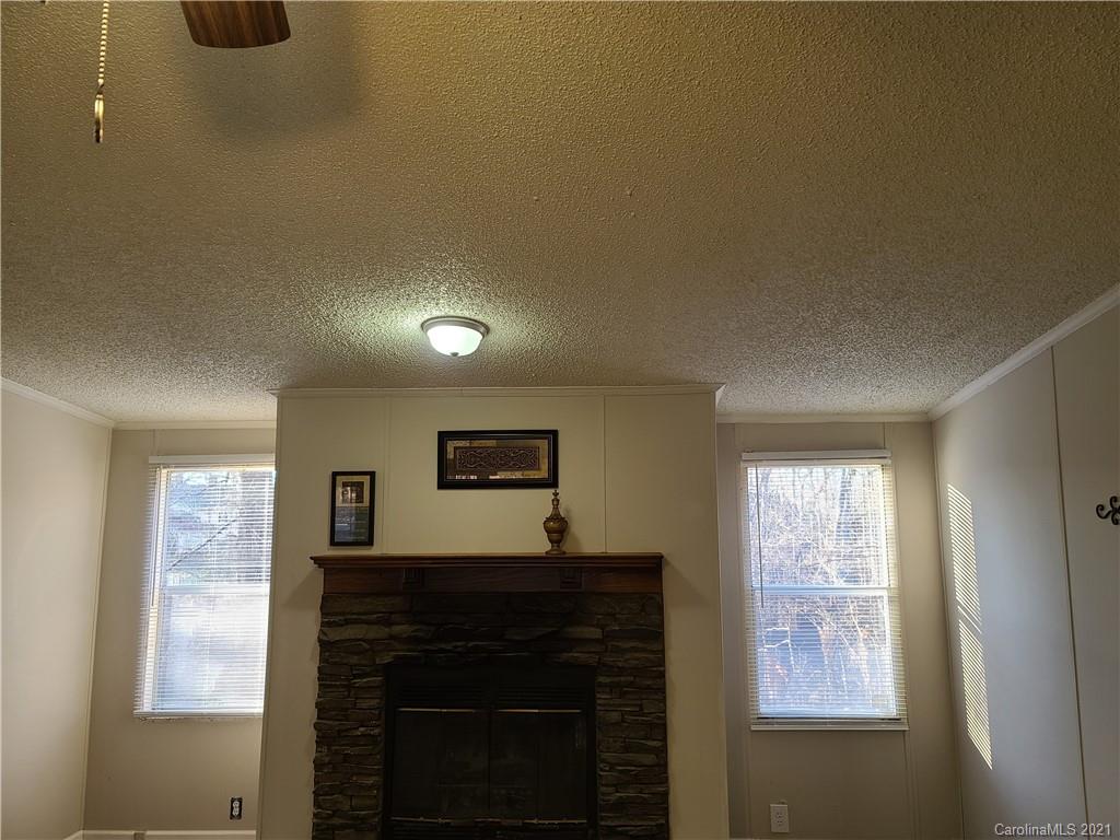 1035 Center Ridge Way Road King, NC 27021 - Photo 8 of 17 a living room with furniture and a fireplace