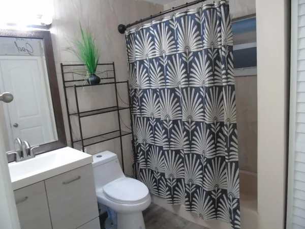 a bathroom with a toilet and a sink