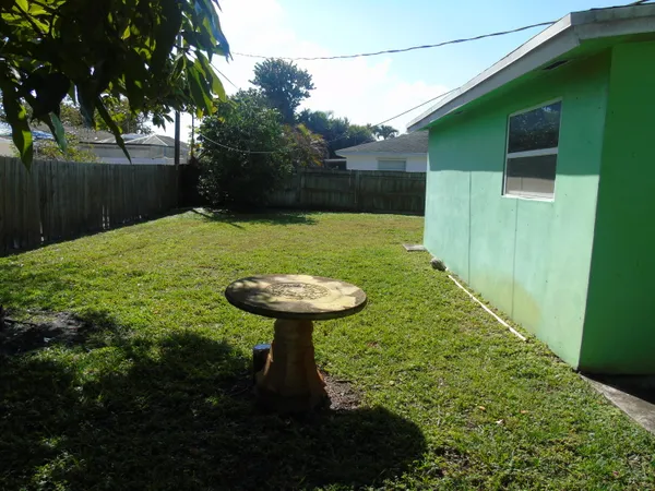 a view of a backyard with a fountain