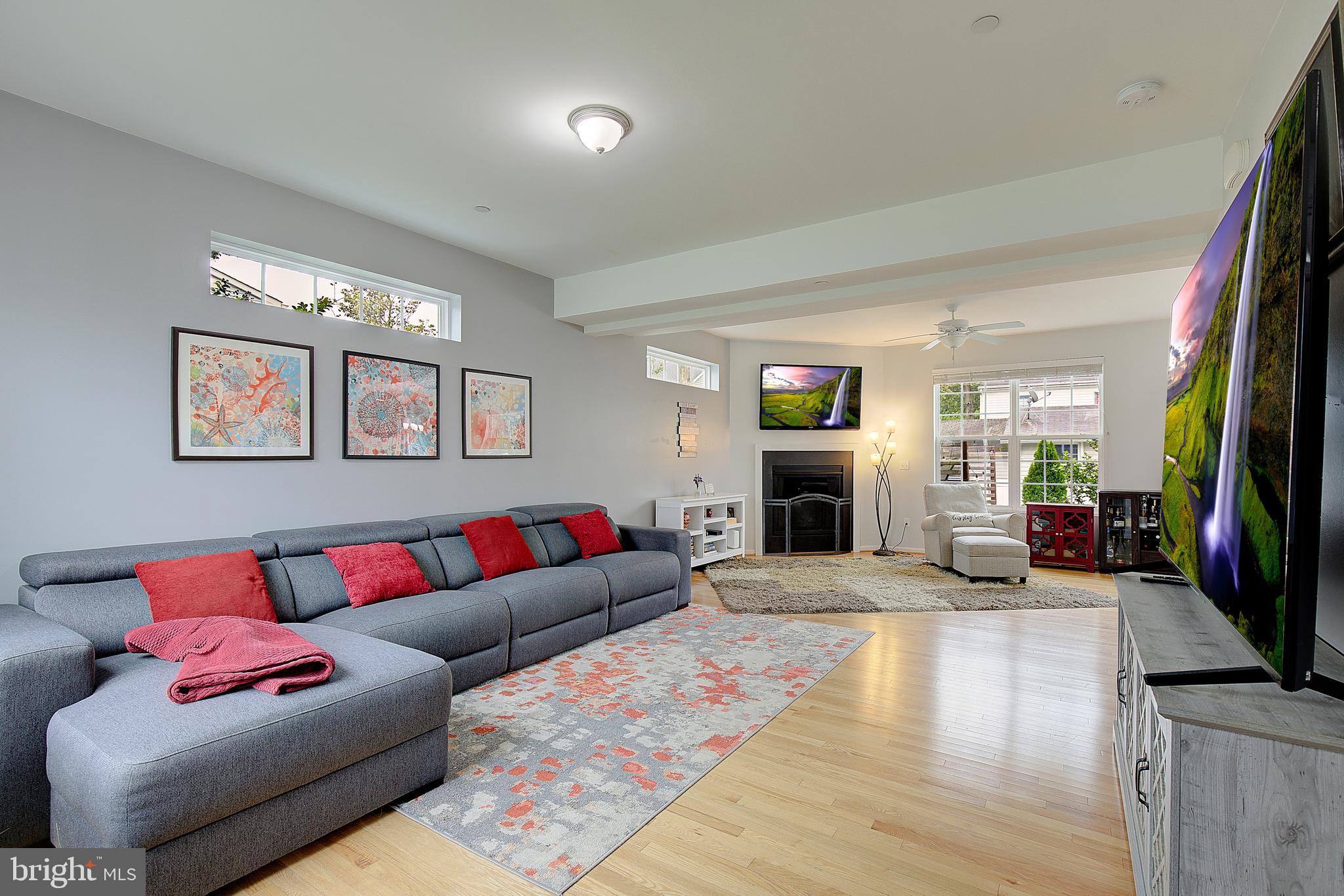 403 Venton Road Edgewater, MD 21037 - Photo 6 of 62 a living room with fireplace furniture and a flat screen tv