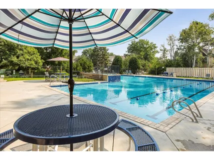 a view of a swimming pool with a patio