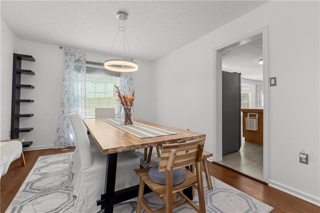1626 Forest Ridge Drive Pittsburgh, PA 15237 - Photo 13 of 34 a view of a dining room with furniture and wooden floor