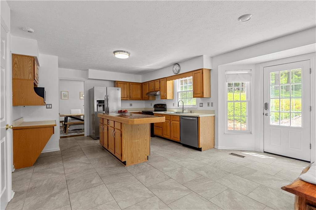 1626 Forest Ridge Drive Pittsburgh, PA 15237 - Photo 16 of 34 a kitchen with a refrigerator and a sink