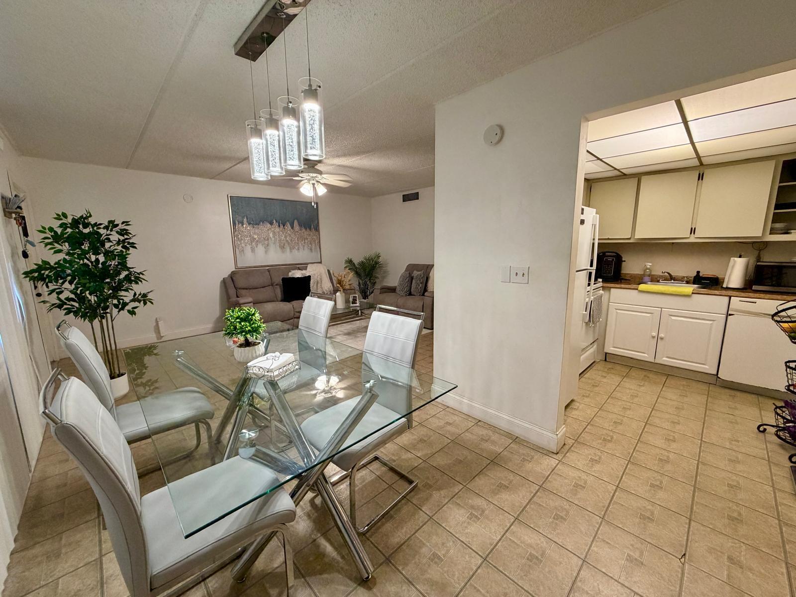 2000 Springdale Boulevard, Unit 102 Palm Springs, FL 33461 - Photo 4 of 11 a view of a dining room with furniture