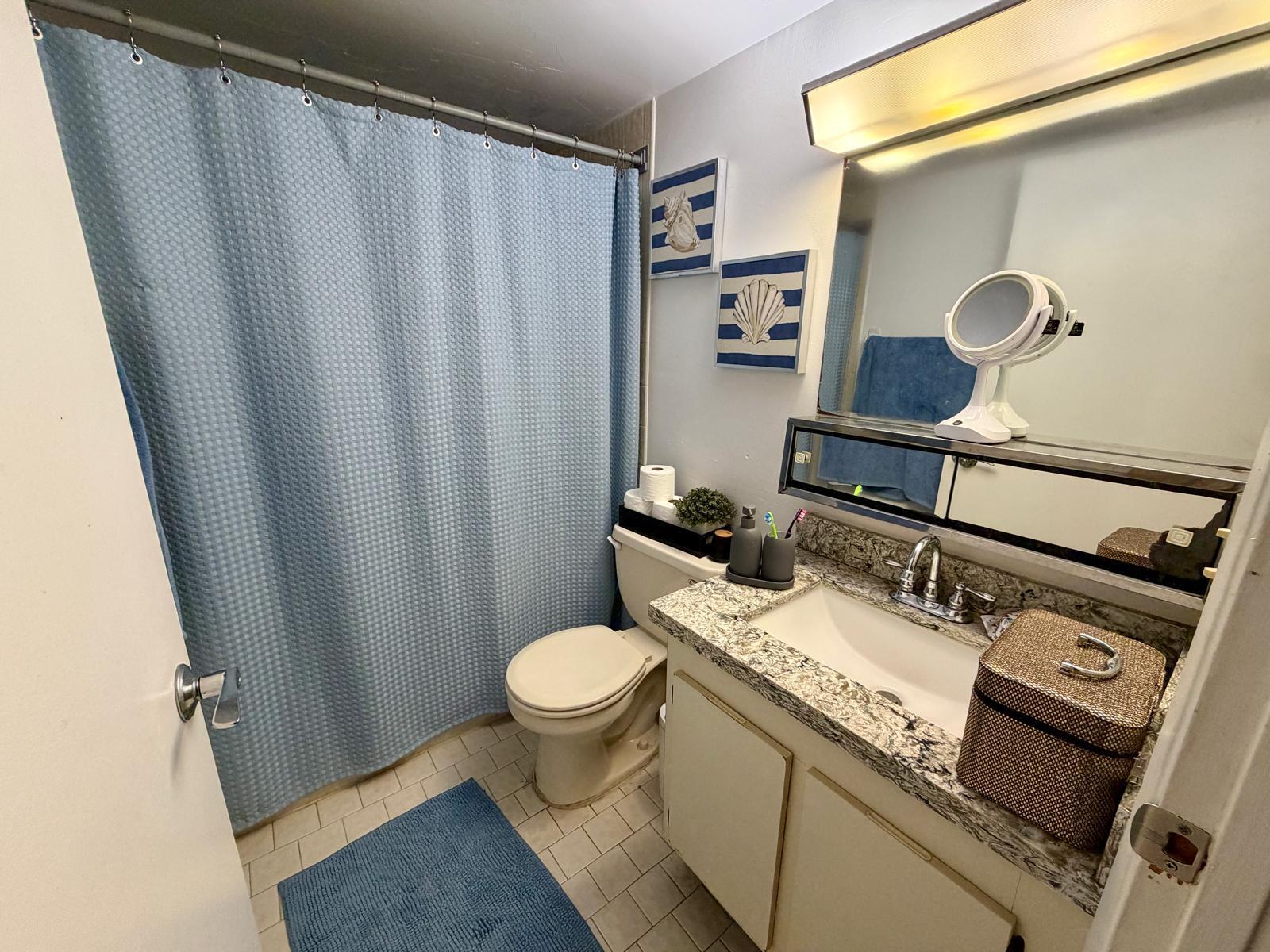 2000 Springdale Boulevard, Unit 102 Palm Springs, FL 33461 - Photo 5 of 11 a bathroom with a sink toilet and shower