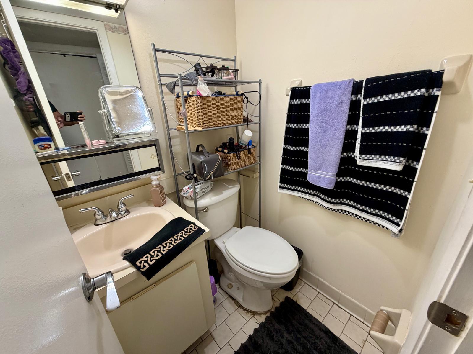 2000 Springdale Boulevard, Unit 102 Palm Springs, FL 33461 - Photo 7 of 11 a bathroom with a toilet and a shower