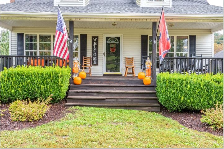 115 East Piney Road Dickson, TN 37055 - Photo 4 of 38 a view of a house with fountain and a bench