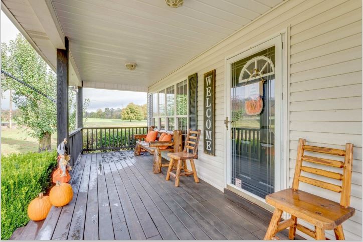 115 East Piney Road Dickson, TN 37055 - Photo 5 of 38 a balcony with chairs and wooden floor