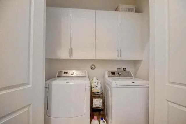 a utility room with dryer and washer