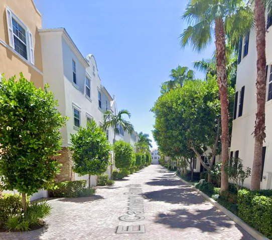 a view of a pathway both side of house