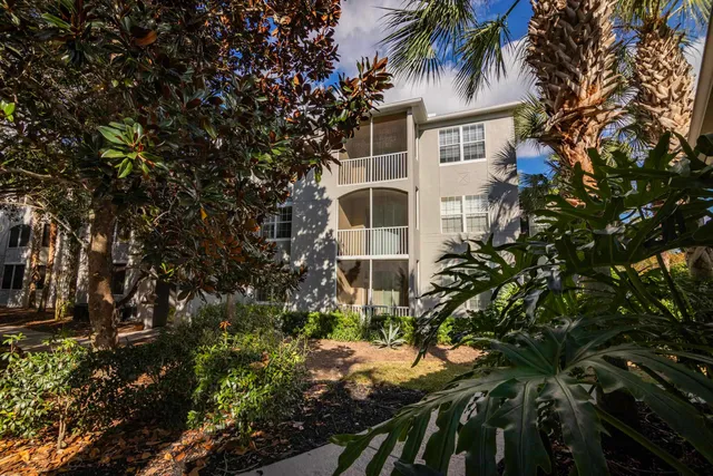 a view of a house with a tree