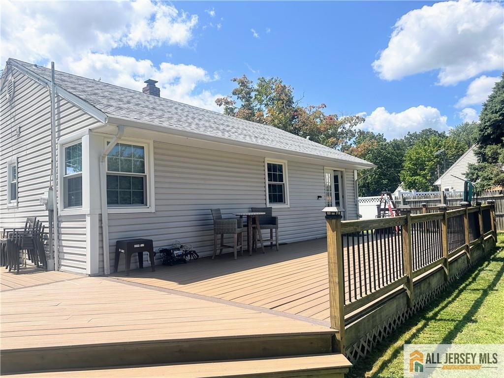4 Burnham Road East Brunswick, NJ 08816 - Photo 20 of 25 a view of a house with a wooden deck