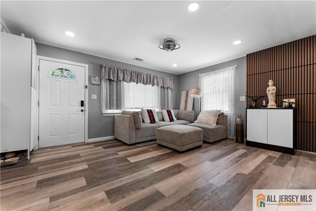 4 Burnham Road East Brunswick, NJ 08816 - Photo 2 of 25 a living room with furniture and a table