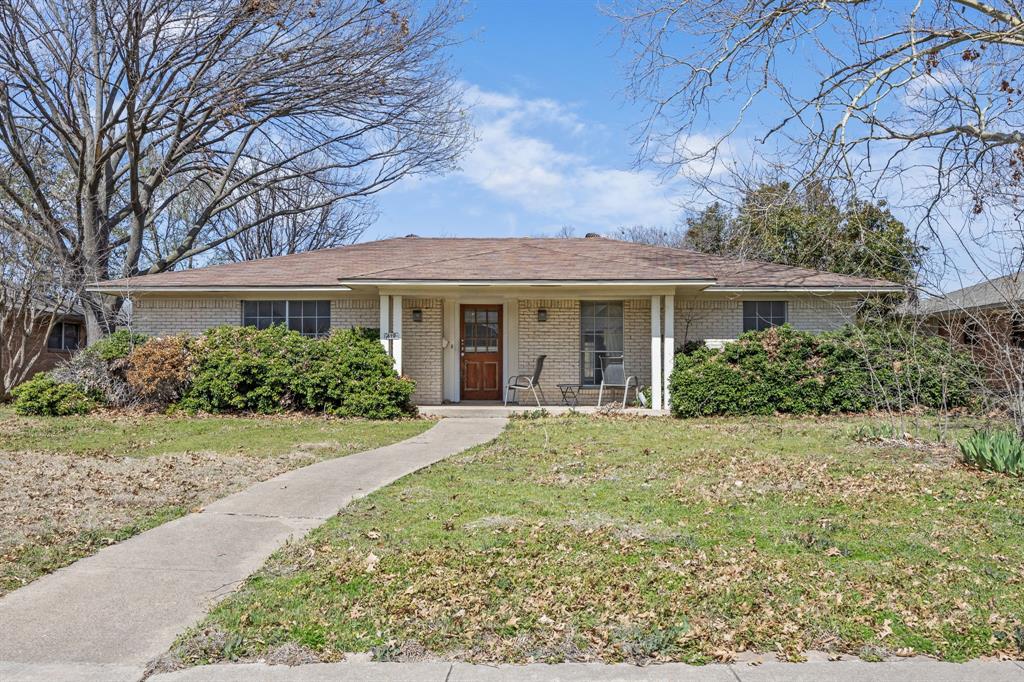419 Summit Drive Richardson, TX 75081 - Photo 1 of 25 front view of house with a yard
