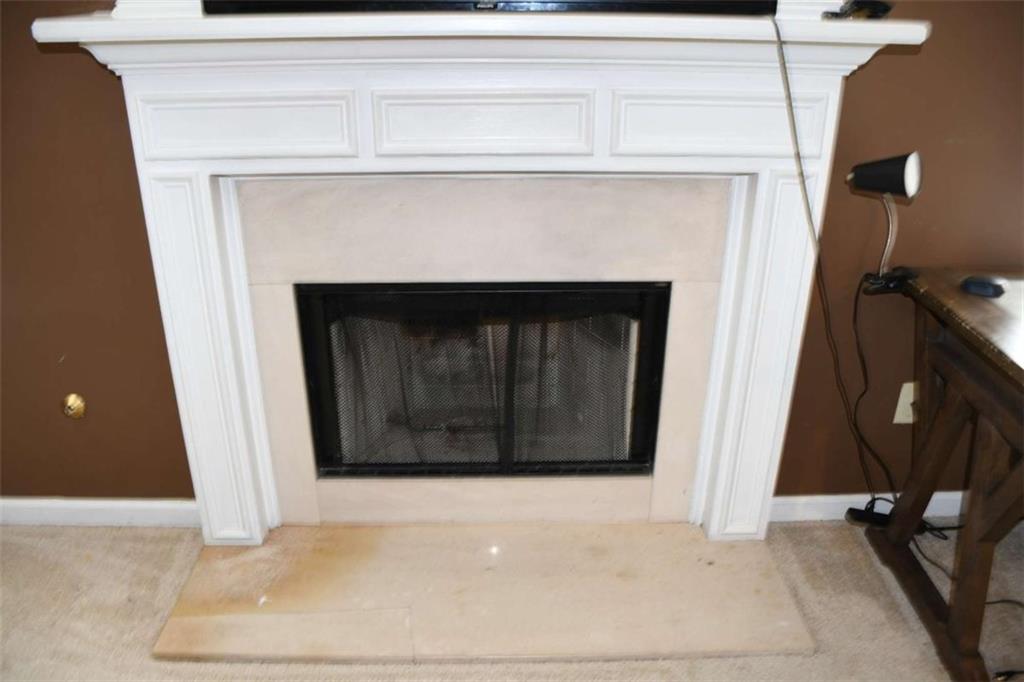 355 Magnolia Walk Lane Atlanta, GA 30349 - Photo 13 of 27 a living room with a fireplace
