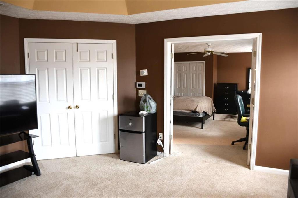 355 Magnolia Walk Lane Atlanta, GA 30349 - Photo 15 of 27 a view of a livingroom with walk in closet and bedroom