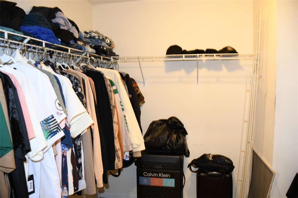 355 Magnolia Walk Lane Atlanta, GA 30349 - Photo 18 of 27 a view of walk in closet with clothes and shoes