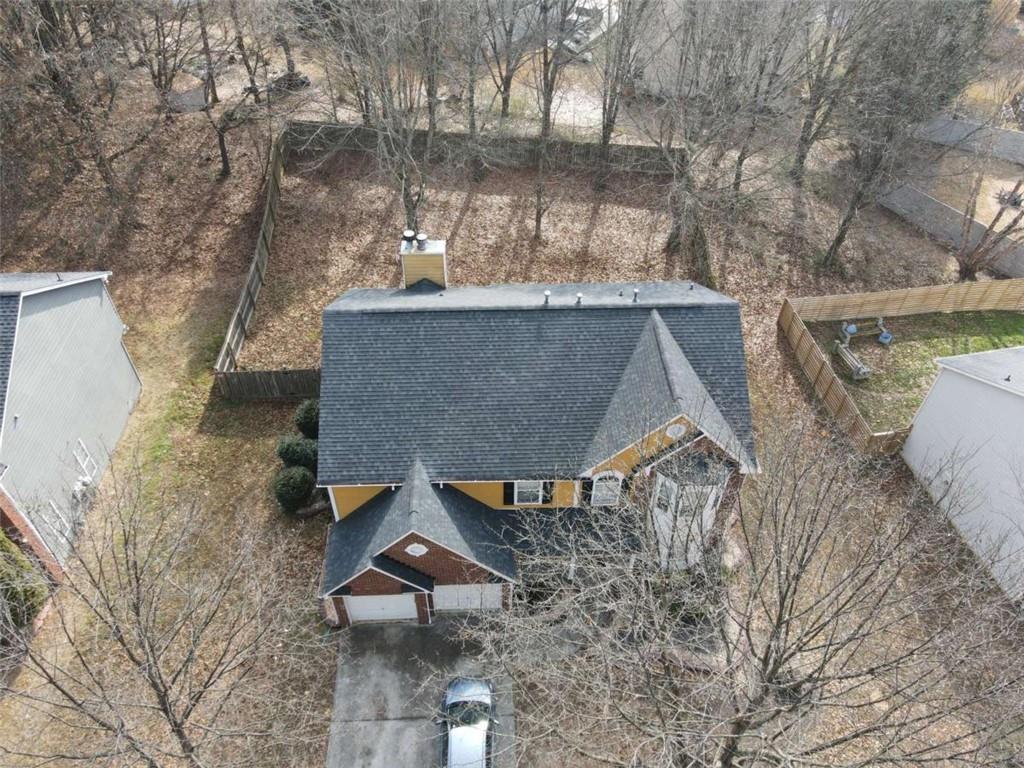 355 Magnolia Walk Lane Atlanta, GA 30349 - Photo 27 of 27 a roof deck view with table and chairs and potted plants