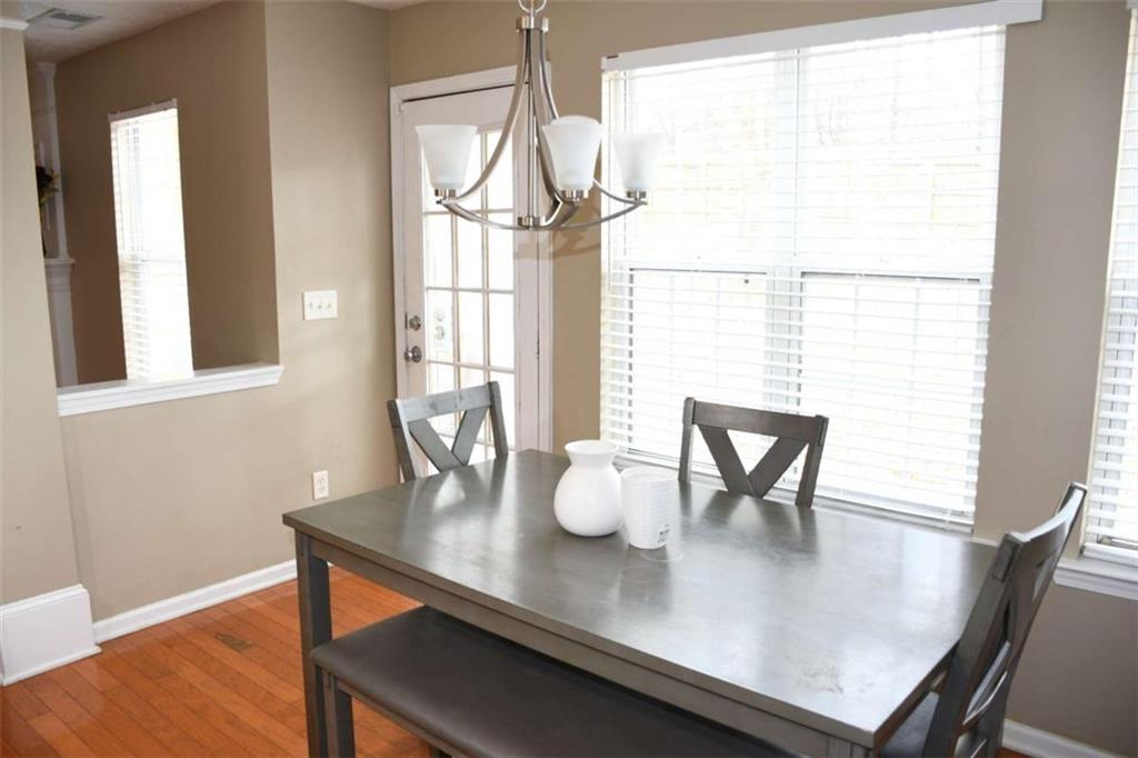 355 Magnolia Walk Lane Atlanta, GA 30349 - Photo 7 of 27 a dining room with furniture and window