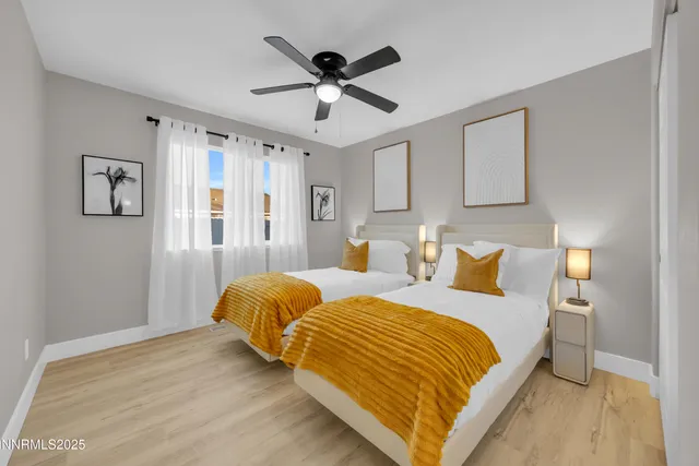 a bedroom with bed and window