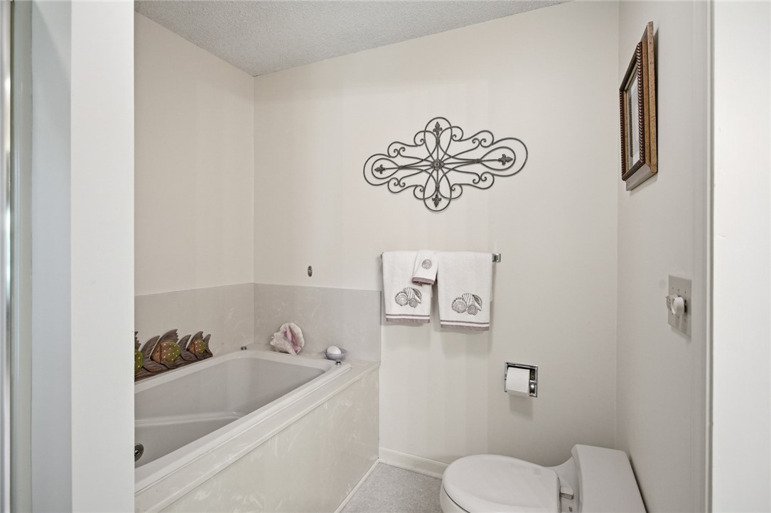 6 Tradewinds Way Salem, SC 29676 - Photo 14 of 50 This serene bathing space features a deep soaking tub, offering a tranquil retreat.