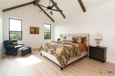 a bedroom with a bed and window