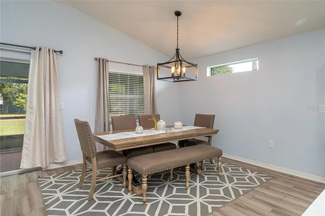 a view of a dining room with furniture window and outside view