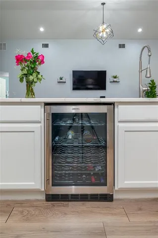 a living room with a potted plant