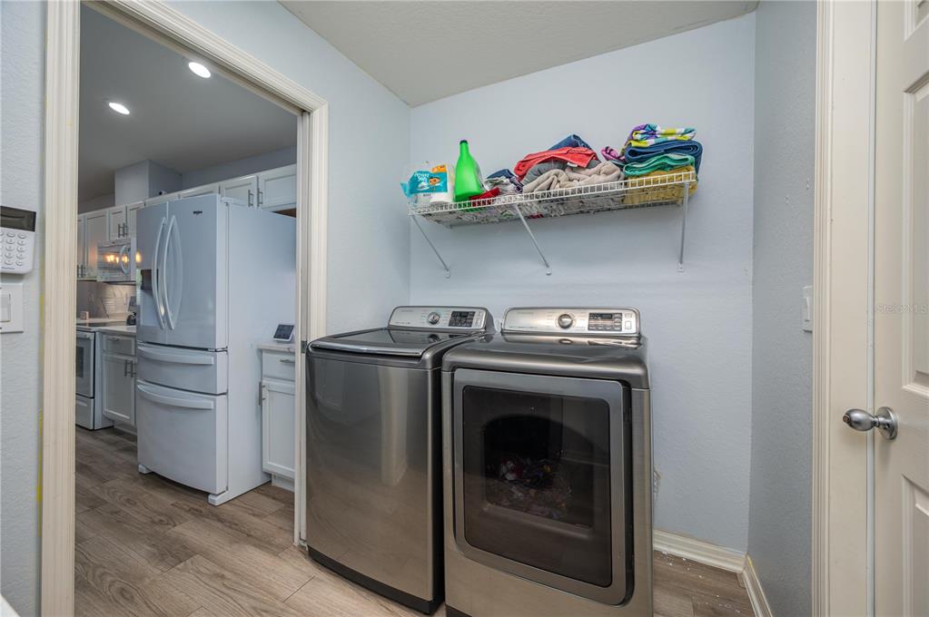 501 Interlock Street Lake Alfred, FL 33850 - Photo 31 of 35 a utility room with dryer and washer